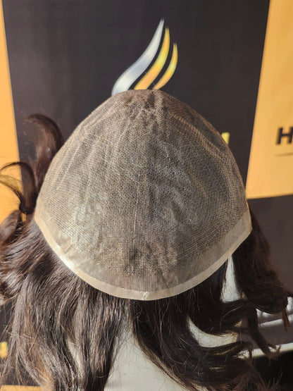 Close-up of a hairpiece on a mannequin head with a blurred background