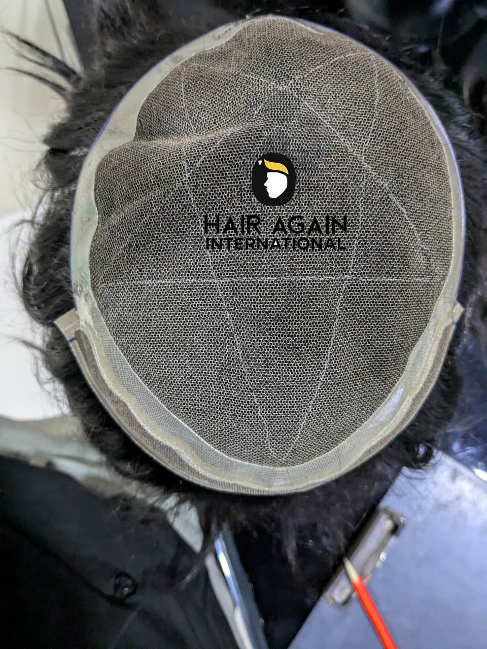 Master Swiss Lace Hair Patch top view with Hair Again International logo
